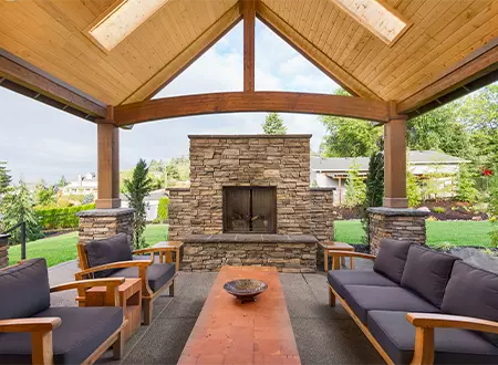 beautiful covered patio with luxury stone fireplace