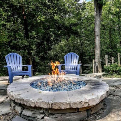 round outdoor fire pit with glass