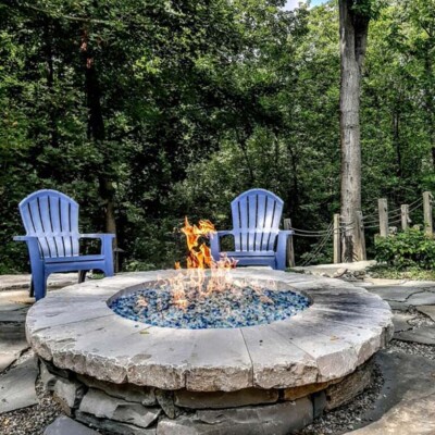 round outdoor fire pit with glass