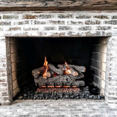 white washed brick fireplace